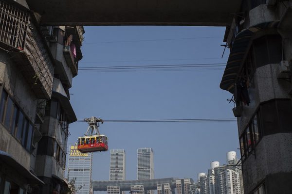 A gondola crosses the gap between two buildings in Chongqing